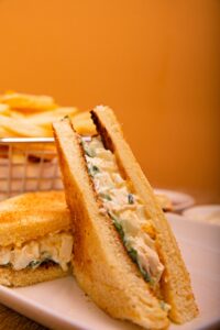 homemade chicken mayo sandwich cut into triangles